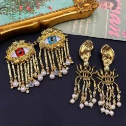 1 Pair Retro French Style Cartoon Character Tassel Eye Inlay Imitation Pearl Alloy Rhinestones Drop Earrings